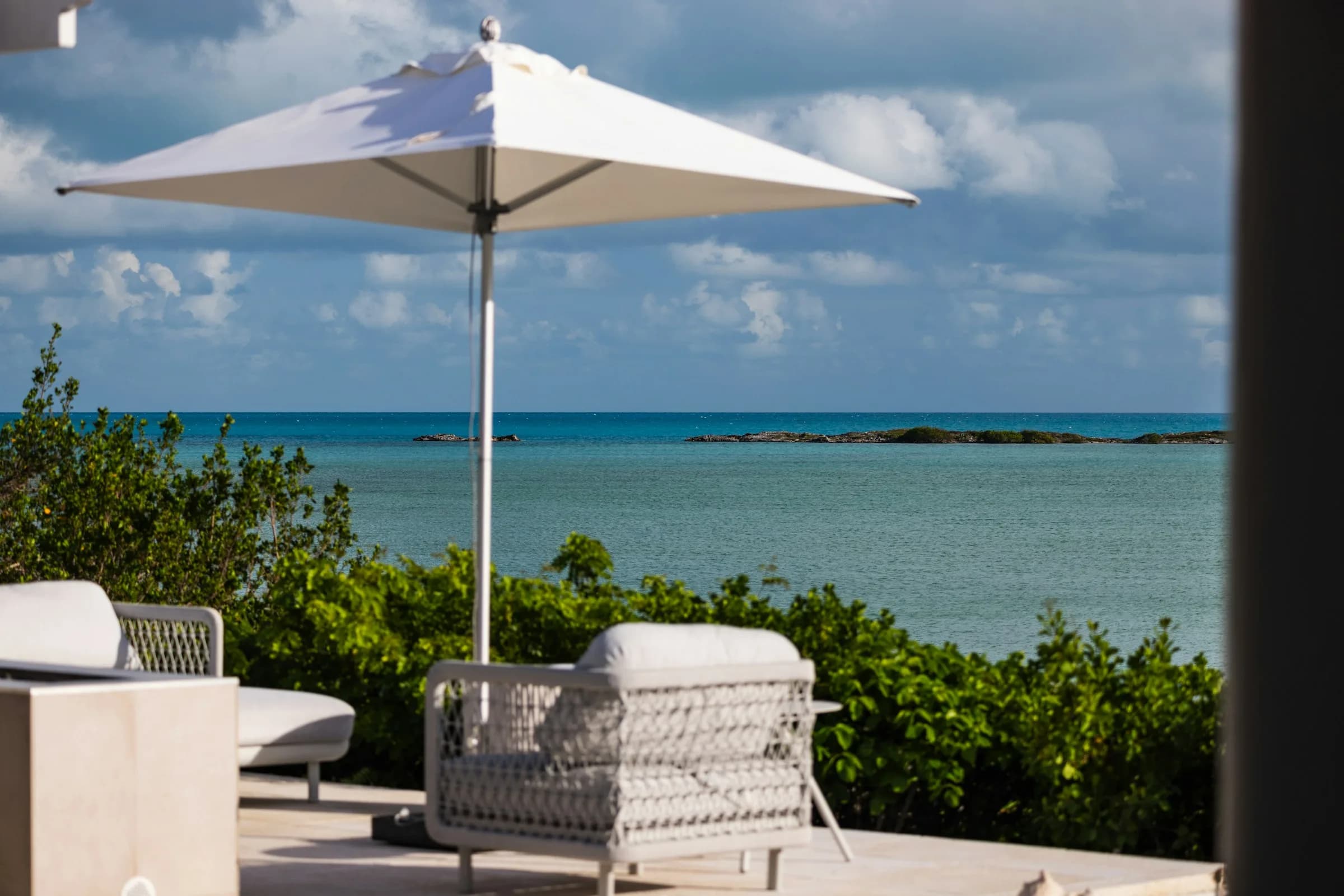 Shaded terrace facing a turquoise sea