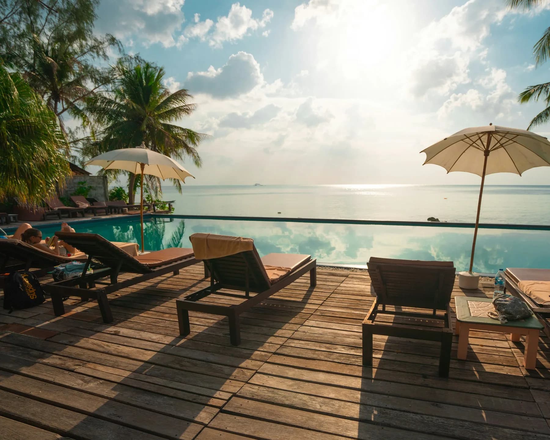 Poolside loungers at a luxury resort at golden hour